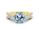 Yellow gold Round Cut Aquamarine Three-Stone Ring with Pavé Split Shank and Four-Prong Setting