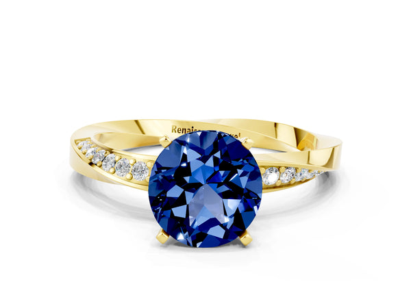 Yellow gold Round Cut Blue Sapphire Engagement Ring with Side Stone Accents and Four-Prong Setting
