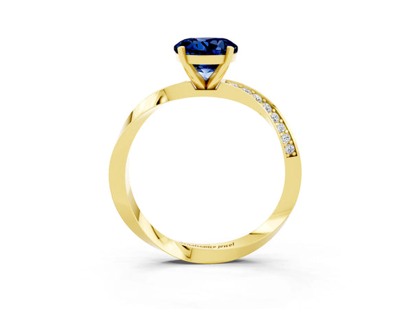 Yellow gold Round Cut Blue Sapphire Engagement Ring with Side Stone Accents and Four-Prong Setting