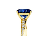 Yellow gold Round Cut Blue Sapphire Engagement Ring with Side Stone Accents and Four-Prong Setting_32