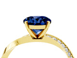 Yellow gold Round Cut Blue Sapphire Engagement Ring with Side Stone Accents and Four-Prong Setting_64