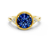 Yellow gold Round Cut Blue Sapphire Halo Ring with Tapered Band and Four-Prong Setting