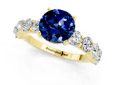 Yellow gold Round Cut Blue Sapphire Prong Setting with Side Stones on a Pave Band_1
