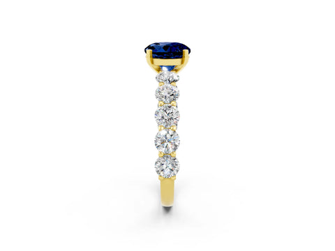 Yellow gold Round Cut Blue Sapphire Prong Setting with Side Stones on a Pave Band_2