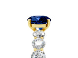 Yellow gold Round Cut Blue Sapphire Prong Setting with Side Stones on a Pave Band_5