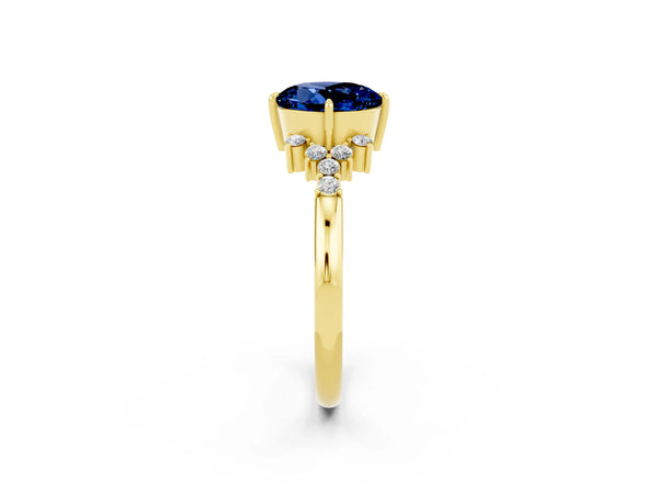 Yellow gold Round Cut Blue Sapphire Ring with Side Stones and Four-Prong Setting
