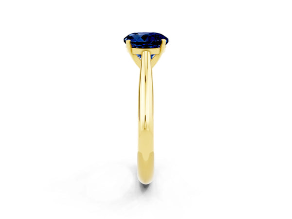 Yellow gold Round Cut Blue Sapphire Solitaire Engagement Ring with Cathedral Setting and Four-Prong Mount