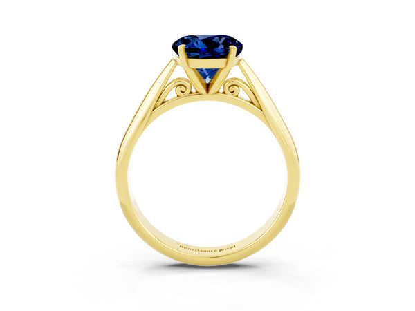 Yellow gold Round Cut Blue Sapphire Solitaire Engagement Ring with Cathedral Setting and Four-Prong Mount
