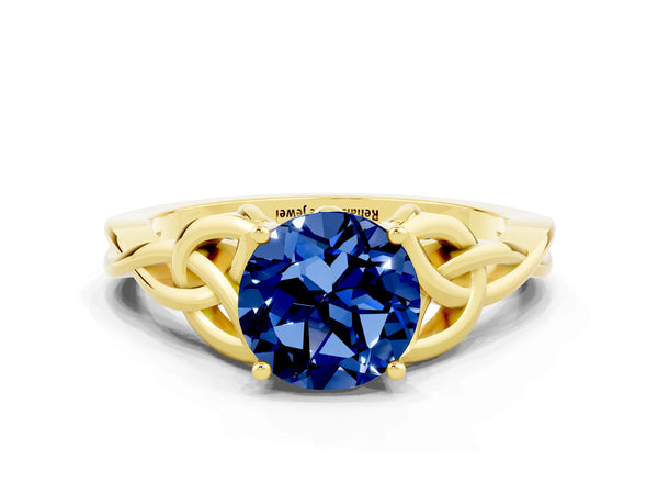 Yellow gold Round Cut Blue Sapphire Solitaire Engagement Ring with Celtic Knot Band and Four-Prong Setting