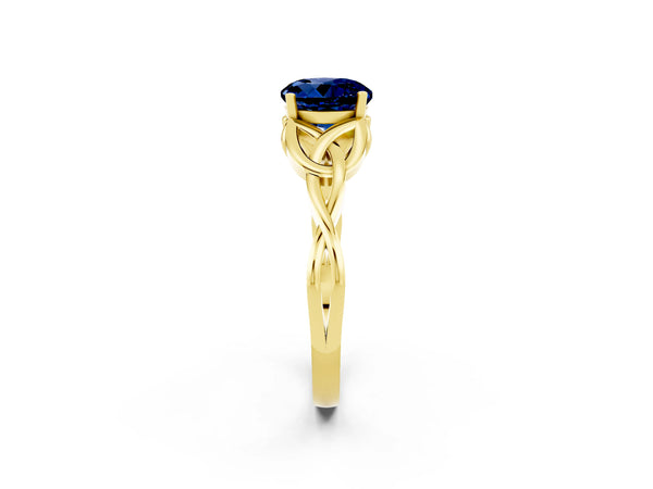 Yellow gold Round Cut Blue Sapphire Solitaire Engagement Ring with Celtic Knot Band and Four-Prong Setting