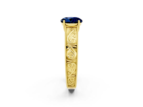 Yellow gold Round Cut Blue Sapphire Solitaire Ring with Engraved Band and Four-Prong Setting