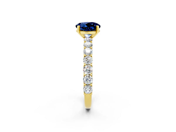 Yellow gold Round Cut Blue Sapphire Solitaire Ring with Shared Prong Pavé Band and Four-Prong Setting