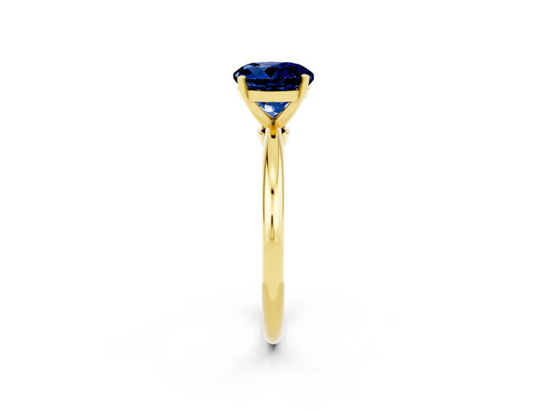 Yellow gold Round Cut Blue Sapphire Solitaire Ring with Six-Prong Setting and Classic Band