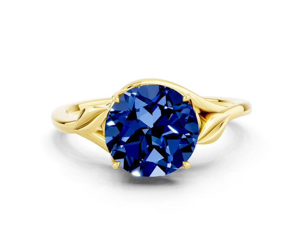 Yellow gold Round Cut Blue Sapphire Solitaire Ring with Twist Band and Four-Prong Setting