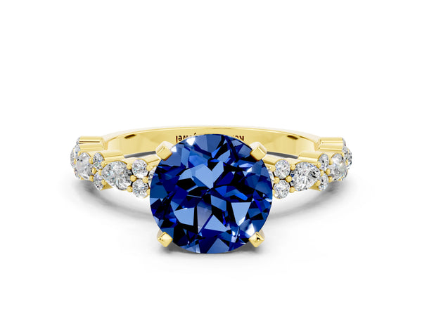 Yellow gold Round Cut Blue Sapphire Side Stone Solitaire Ring with Round  and Four-Prong Setting