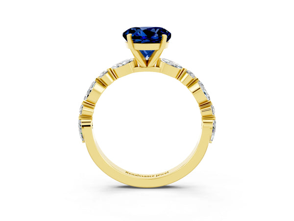Yellow gold Round Cut Blue Sapphire Ring with Marquise and Round  Side Stones and Four-Prong Setting