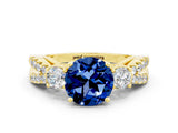 Yellow gold Round Cut Blue Sapphire Three-Stone Ring with Pavé Split Shank and Four-Prong Setting