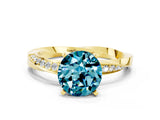 Yellow gold Round Cut Blue Topaz Engagement Ring with Side Stone Accents and Four-Prong Setting_27