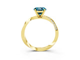 Yellow gold Round Cut Blue Topaz Engagement Ring with Side Stone Accents and Four-Prong Setting_63