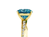 Yellow gold Round Cut Blue Topaz Engagement Ring with Side Stone Accents and Four-Prong Setting_65