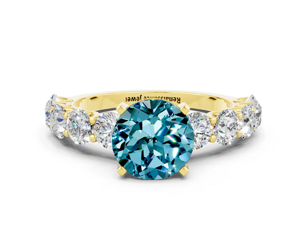 Yellow gold Round Cut Blue Topaz Prong Setting with Side Stones on a Pave Band