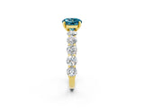 Yellow gold Round Cut Blue Topaz Prong Setting with Side Stones on a Pave Band_2