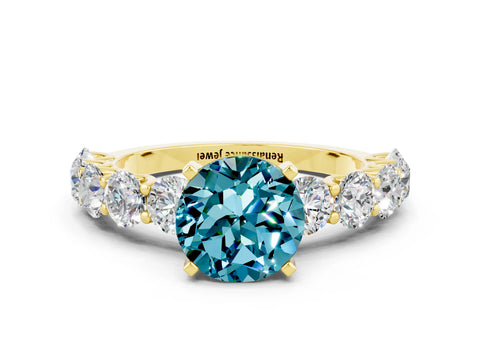 Yellow gold Round Cut Blue Topaz Prong Setting with Side Stones on a Pave Band
