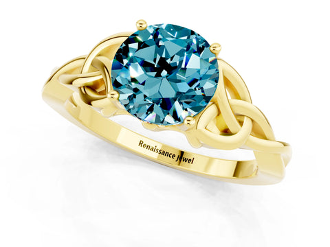 Yellow gold Round Cut Blue Topaz Solitaire Engagement Ring with Celtic Knot Band and Four-Prong Setting_1