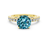 Yellow gold Round Cut Blue Topaz Solitaire Pavé Band with Four-Prong Setting