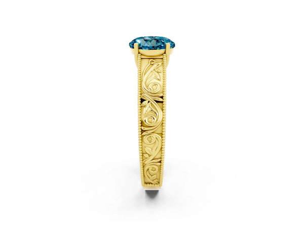Yellow gold Round Cut Blue Topaz Solitaire Ring with Engraved Band and Four-Prong Setting