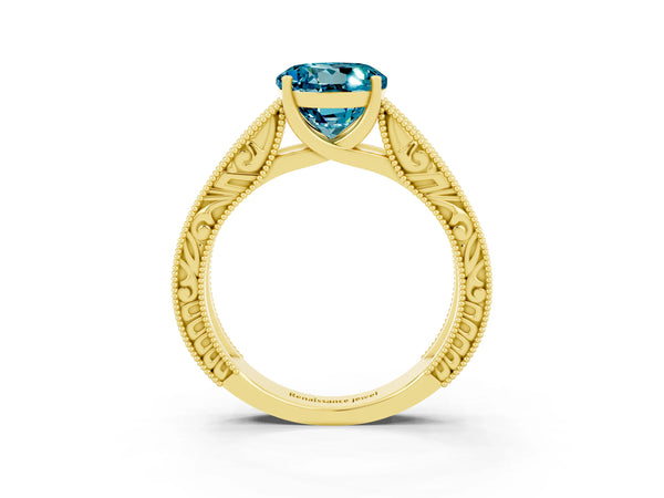 Yellow gold Round Cut Blue Topaz Solitaire Ring with Engraved Band and Four-Prong Setting