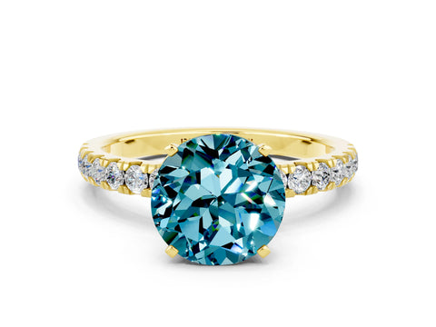 Yellow gold Round Cut Blue Topaz Solitaire Ring with Pavé Accents and Four-Prong Setting