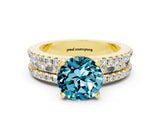 Yellow gold Round Cut Blue Topaz Solitaire Ring with Pavé and Channel Set Band