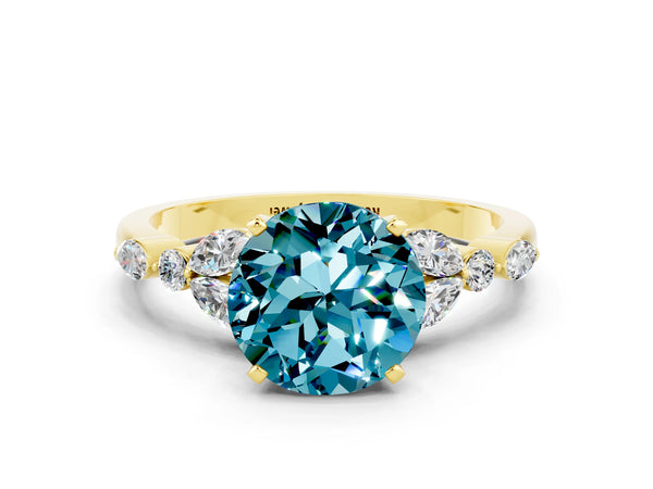 Yellow gold Round Cut Blue Topaz Solitaire Ring with Side Stones and Four-Prong Setting