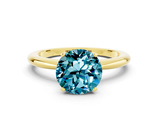 Yellow gold Round Cut Blue Topaz Solitaire Ring with Six-Prong Setting and Classic Band