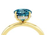 Yellow gold Round Cut Blue Topaz Solitaire Ring with Thin Band and Four-Prong Setting_16