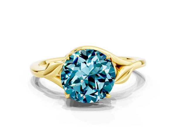 Yellow gold Round Cut Blue Topaz Solitaire Ring with Twist Band and Four-Prong Setting