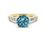 Yellow gold Round Cut Blue Topaz Solitaire with Side Baguettes and Channel Set Band