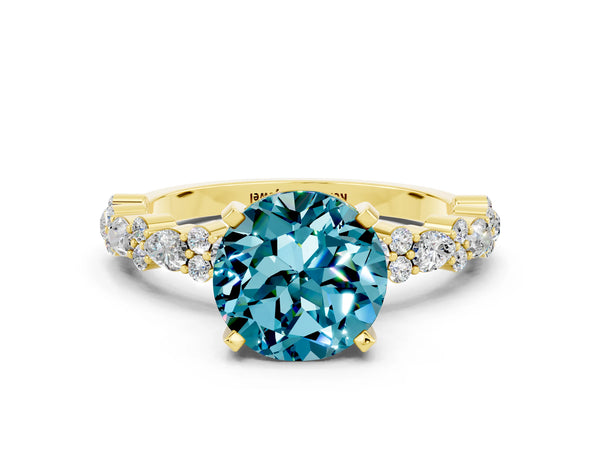 Yellow gold Round Cut Blue Topaz Side Stone Solitaire Ring with Round  and Four-Prong Setting