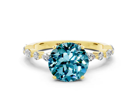 Yellow gold Round Cut Blue Topaz Solitaire with Side Stones on a Pavé Band and Four-Prong Setting