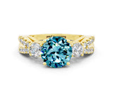 Yellow gold Round Cut Blue Topaz Three-Stone Ring with Pavé Split Shank and Four-Prong Setting