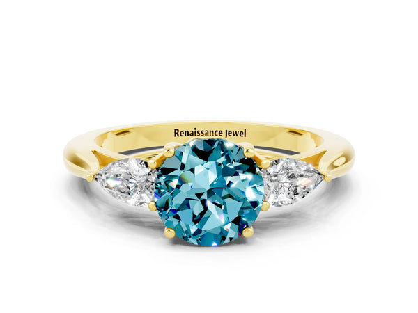 Yellow gold Round Cut Blue Topaz Three-Stone Ring with Pear  Side Stones and Prong Setting