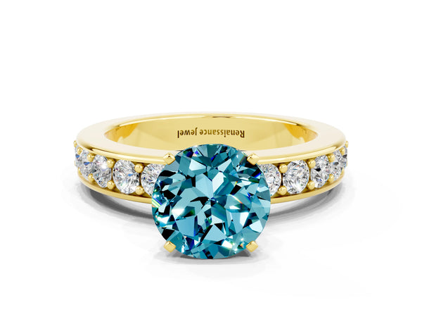 Yellow gold Round Cut Blue Topaz Engagement Ring with Channel Set Round Band and Prong Setting