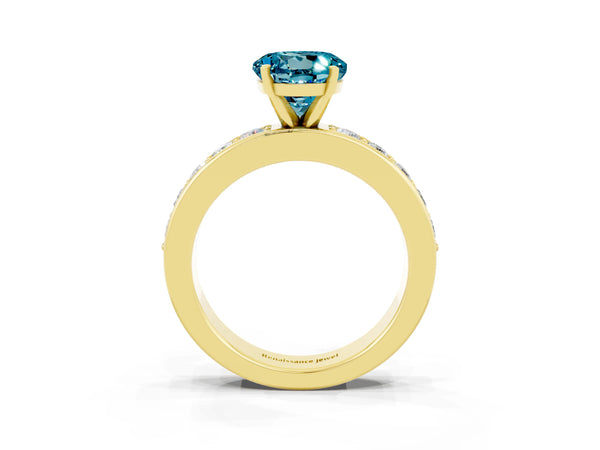 Yellow gold Round Cut Blue Topaz Engagement Ring with Channel Set Round Band and Prong Setting