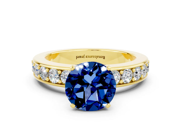 Yellow gold Round Cut Blue Sapphire Engagement Ring with Channel Set Round Band and Prong Setting