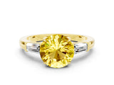 Yellow gold Round Cut Cut Diamond Ring with Tapered Baguette Side Stones in Four-Prong Setting