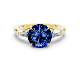 Yellow gold Round Cut Cut Diamond Ring with Tapered Baguette Side Stones in Four-Prong Setting