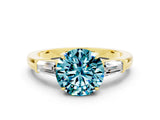 Yellow gold Round Cut Cut Diamond Ring with Tapered Baguette Side Stones in Four-Prong Setting
