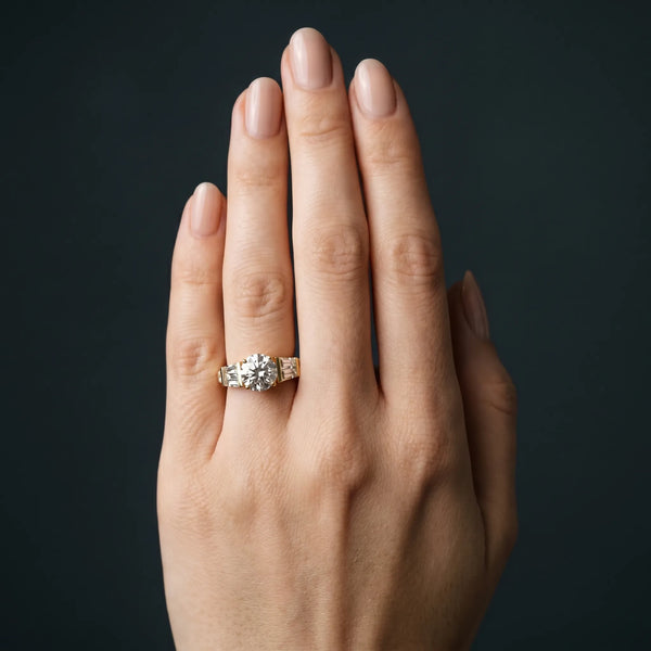 Yellow gold Round Cut Diamond Engagement Ring with Baguette Side Stones and Channel Set Band
