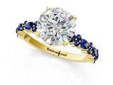 Yellow gold Round Cut Diamond Side Stone Solitaire Ring with Round with Blue Sapphire side stone and Four-Prong Setting_1